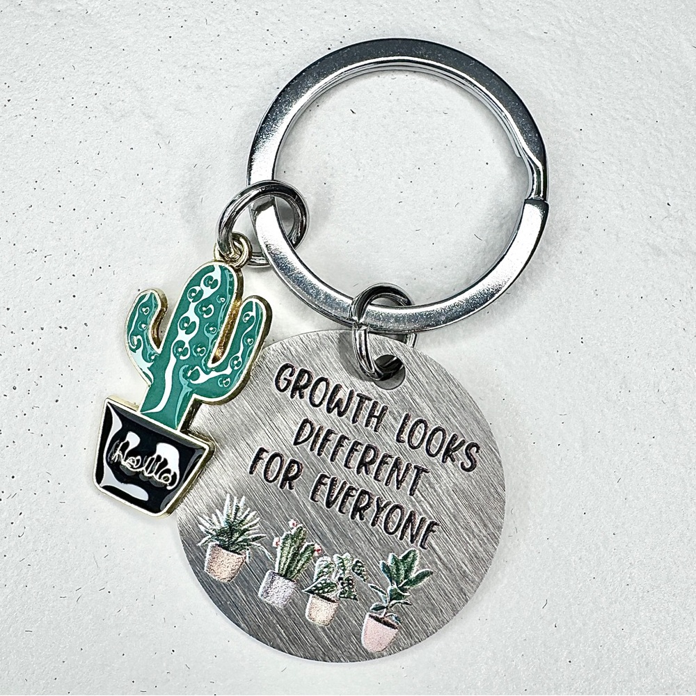 ‘GROWTH LOOKS DIFFERENT ON EVERYONE’ SILVER KEYCHAIN WITH CACTUS CHARM